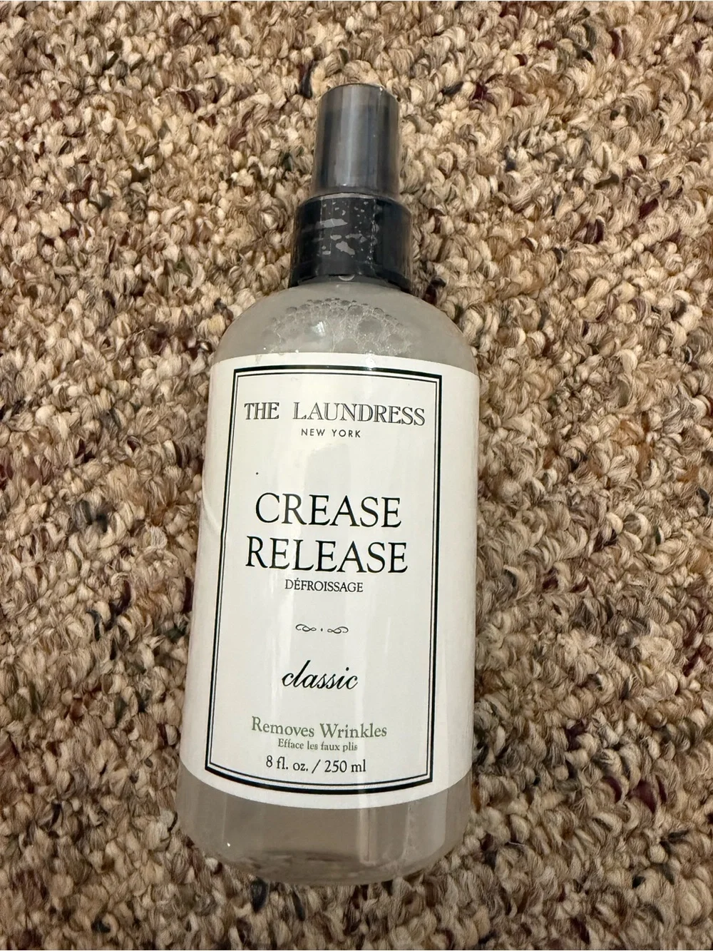 The Laundress Crease Release Spray - Clear Bottle with Black Cap